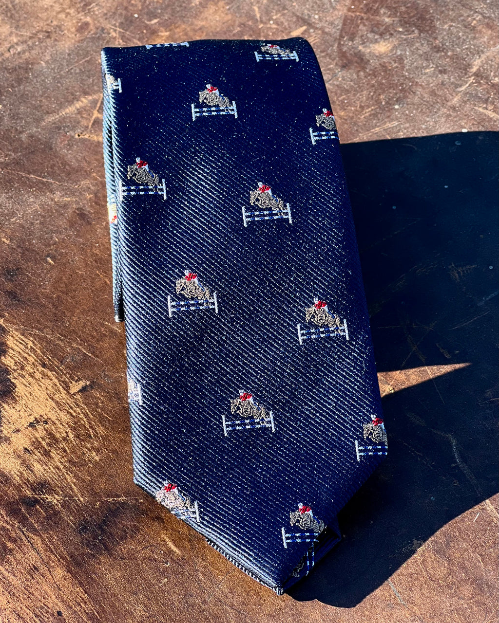 Pure silk tie featuring show jumping motif