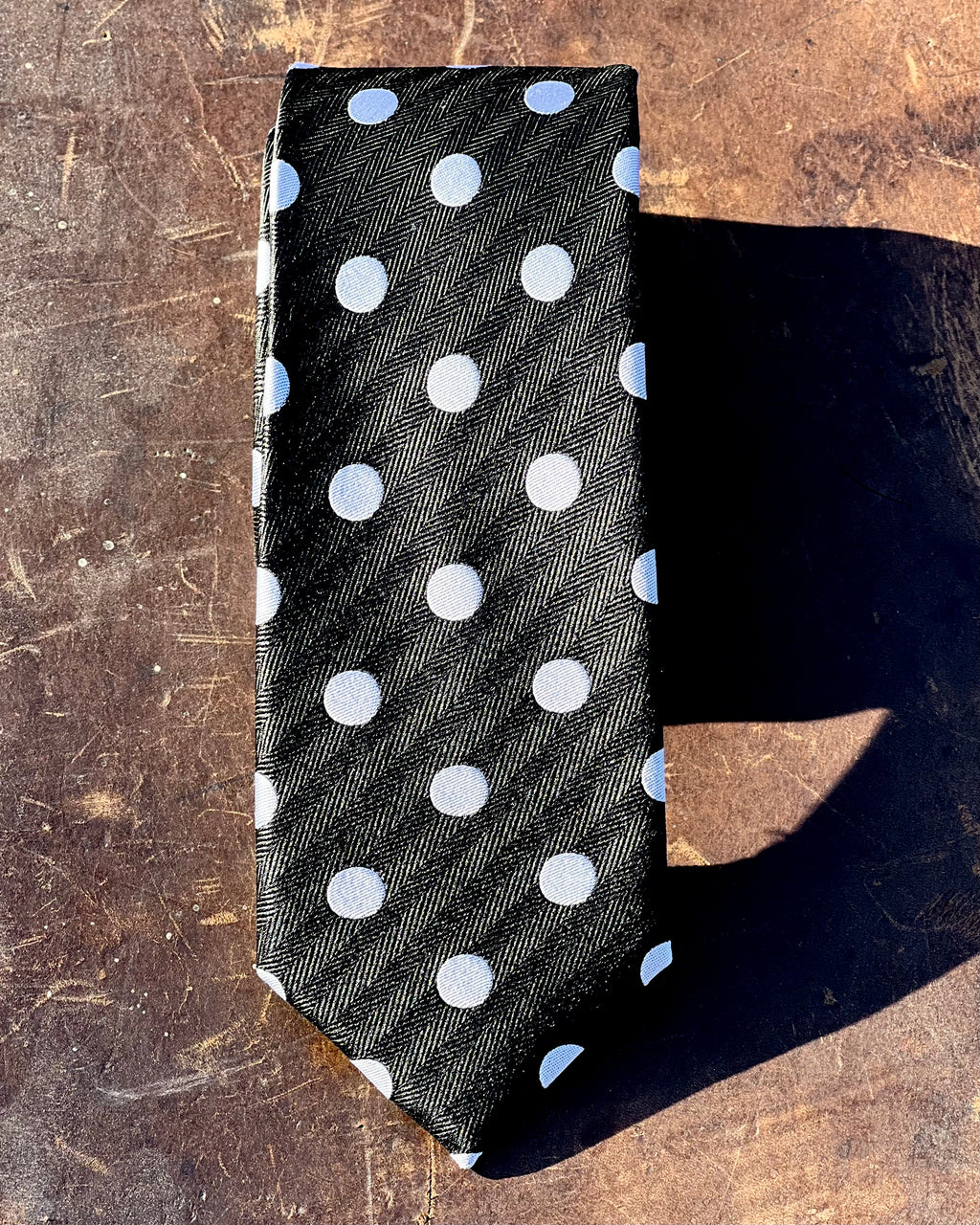 Black silk tie with white spots
