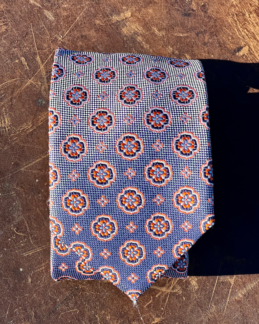 Pure silk tie by Silandro in repeating flower pattern