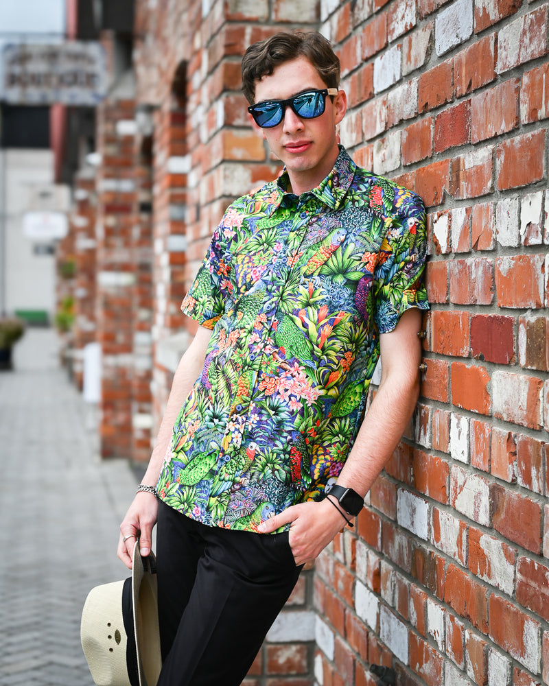 Man wearing a short-sleeve cotton tropical bird print shirt by Mr Peacock made in NZ