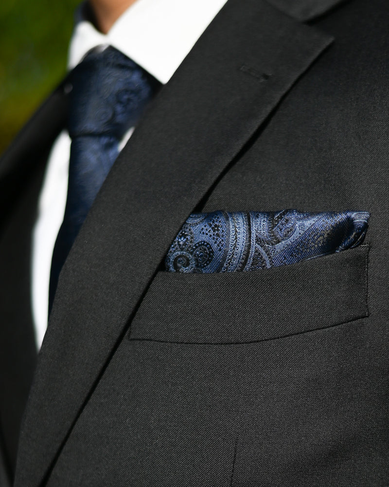 Navy blue paisley pocket square worn with black suit