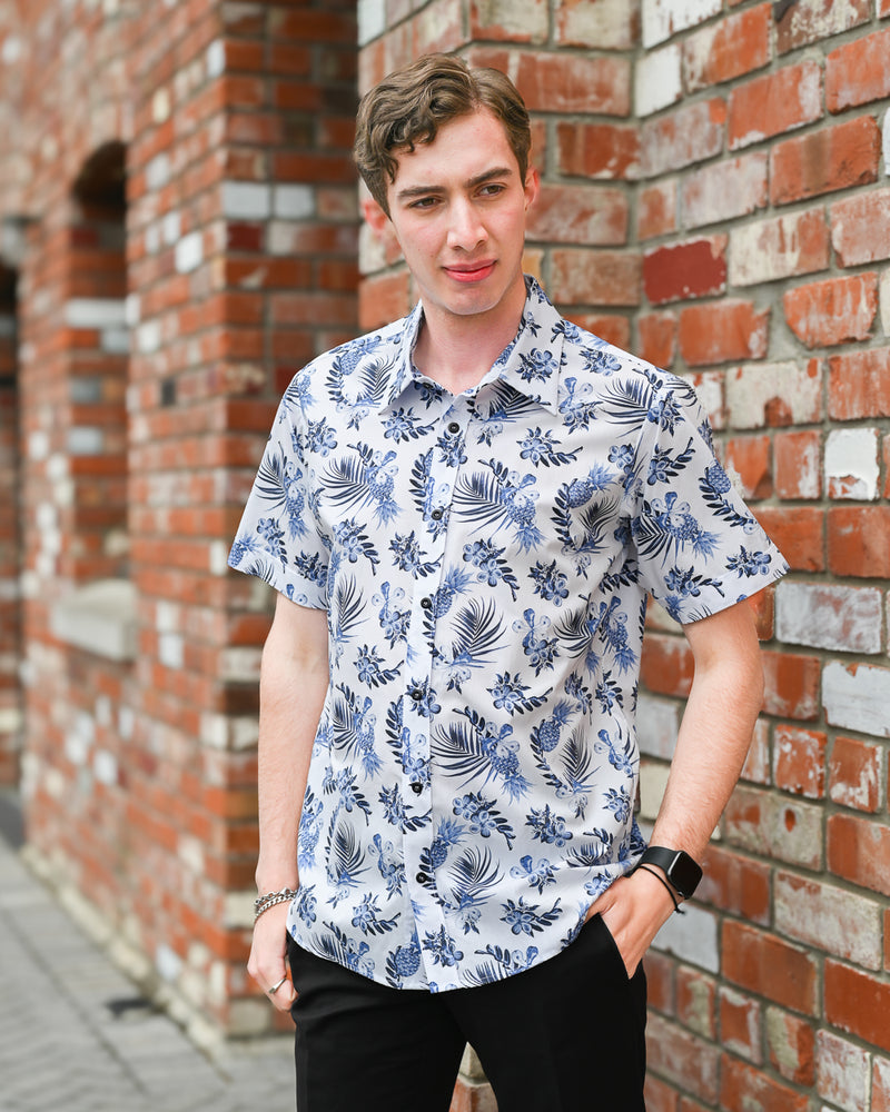 Man wearing a short-sleeve cotton hawaiian print shirt by Mr Peacock made in NZ