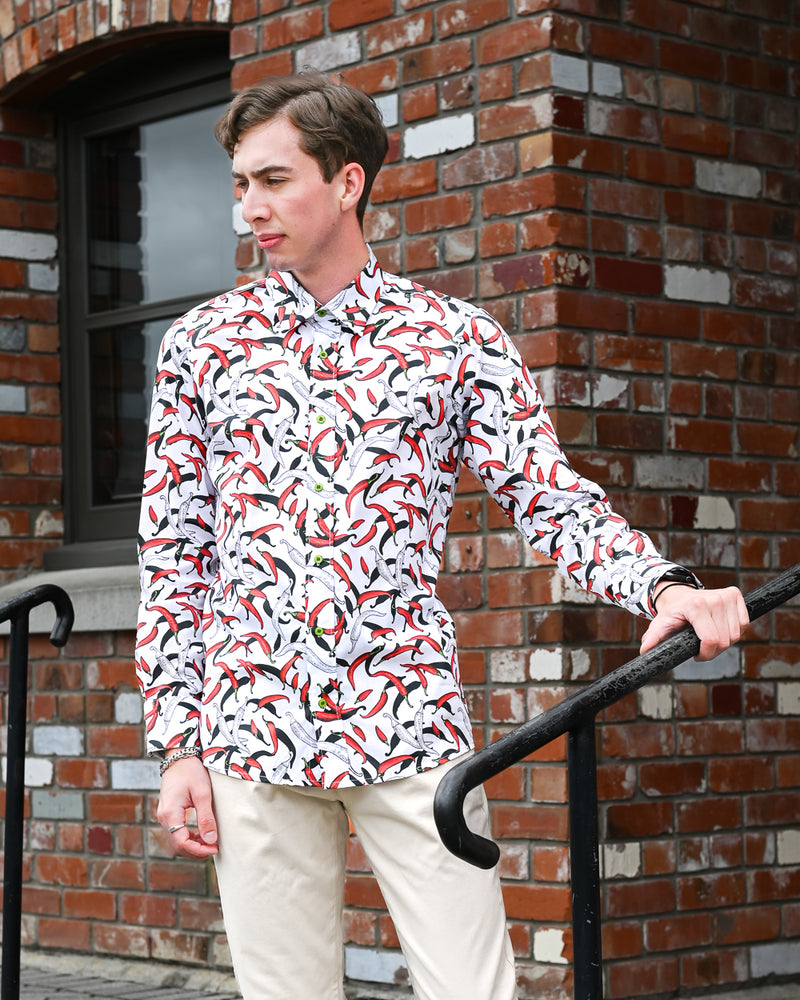Man wearing a long-sleeve cotton chilli print shirt by Mr Peacock made in NZ