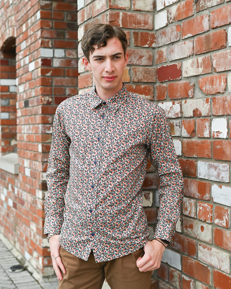 Man wearing a long-sleeve cotton fruit print shirt by Mr Peacock made in NZ