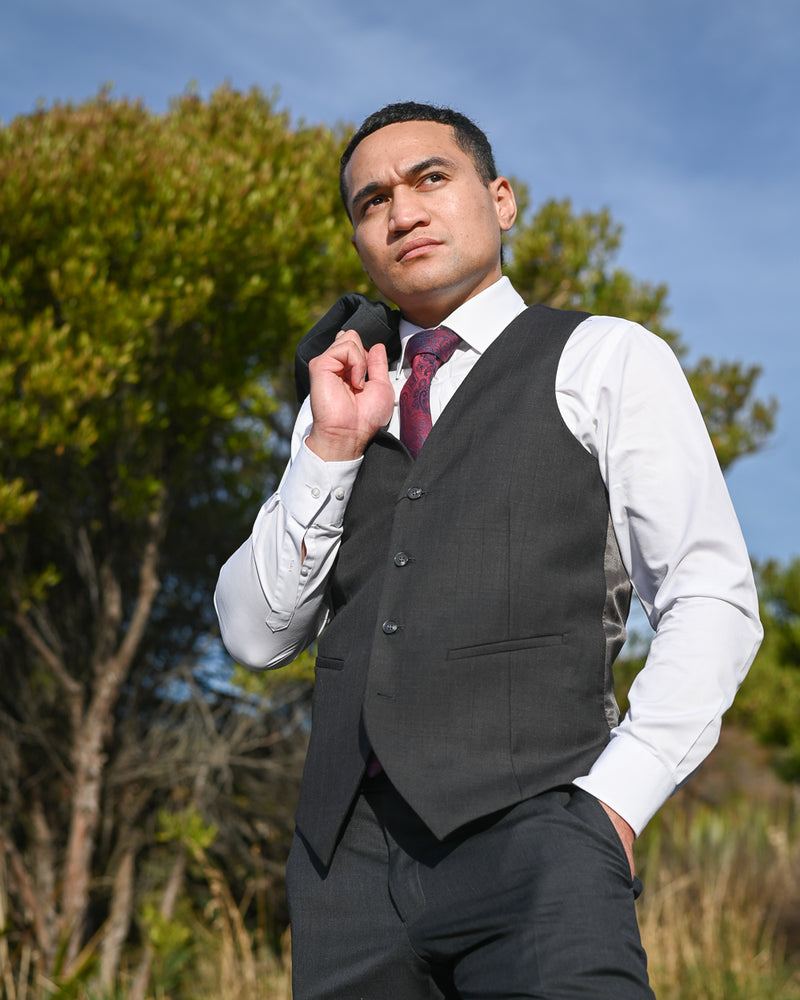 Handsome young Samoan man in Savile Row wool-mix waistcoat