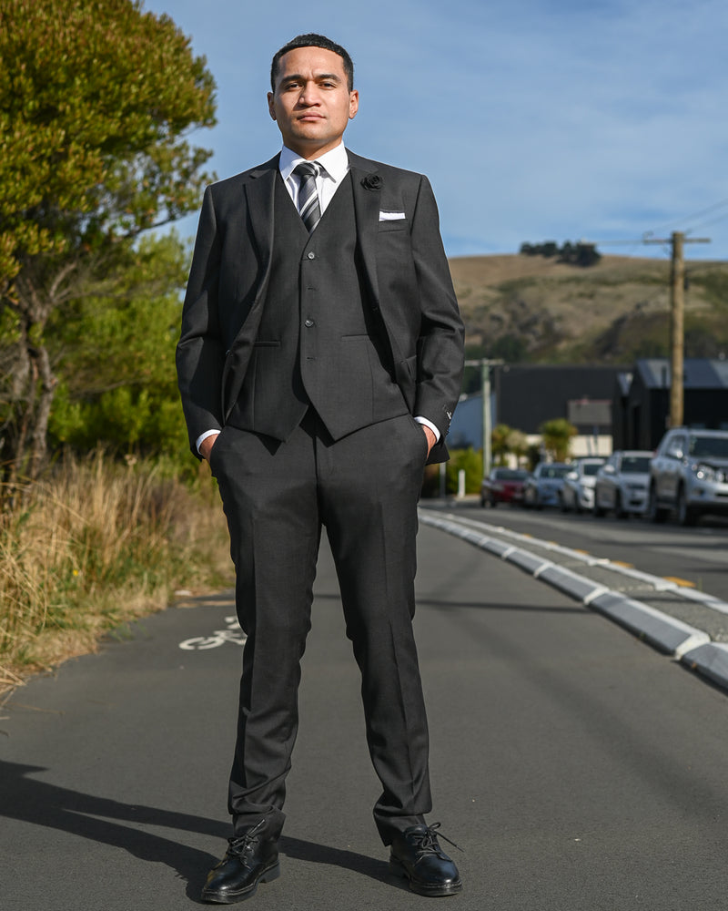 Handsome young man wearing savile row three-piece suit Abram B5 Charcoal