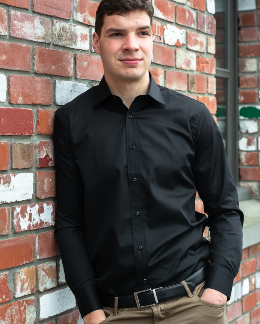 Young man wearing a plain black shirt by Boston