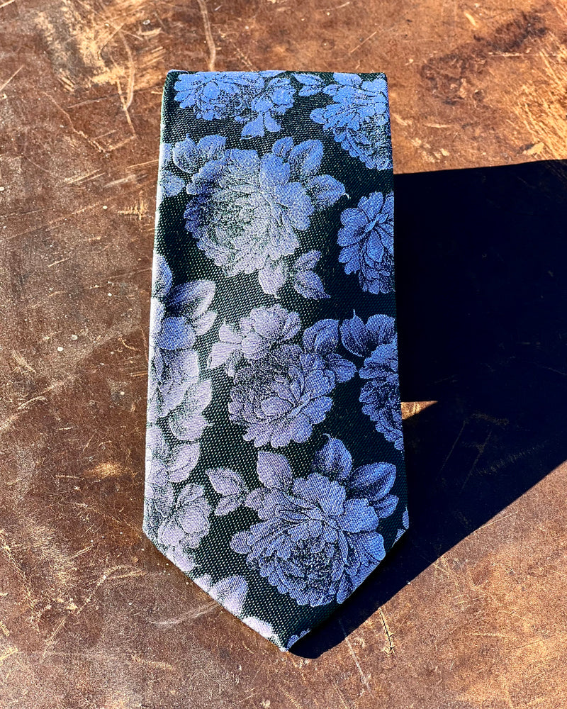 Pure silk tie featuring purple roses against a black backgtround