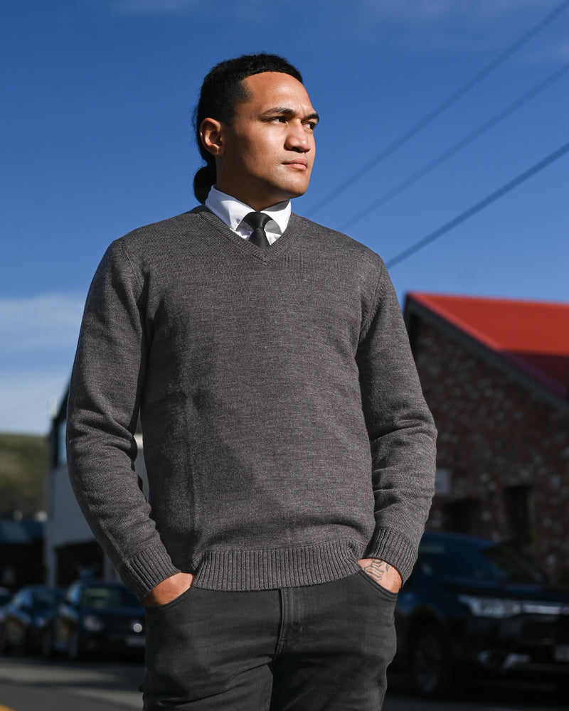 Handsome young man in grey v-neck pullover by Silverdale available at Munns the Man's Store