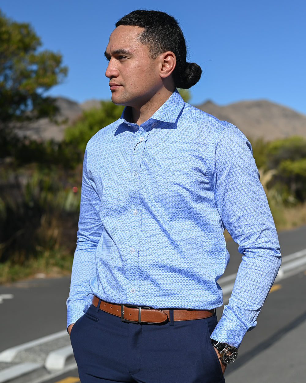 Young Samoan man in sky-blue cotton shirt by Thomson & Richards
