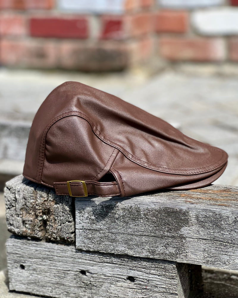Dark brown cheese cutter cap in faux leather by Electric Pukeko