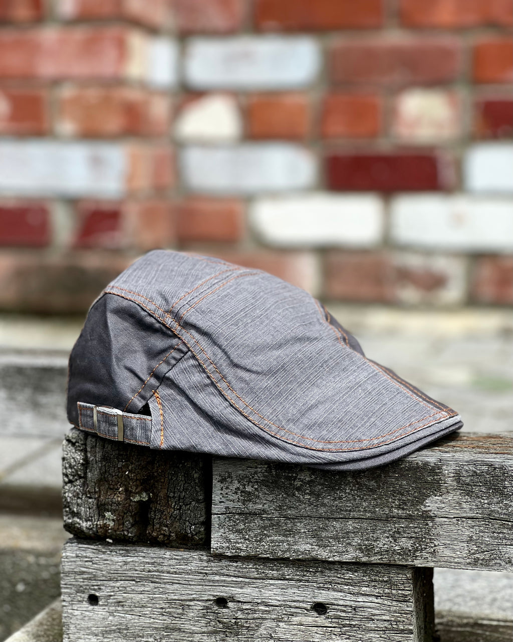 Retro-style flat cap by Electric Pukeko with side adjustment