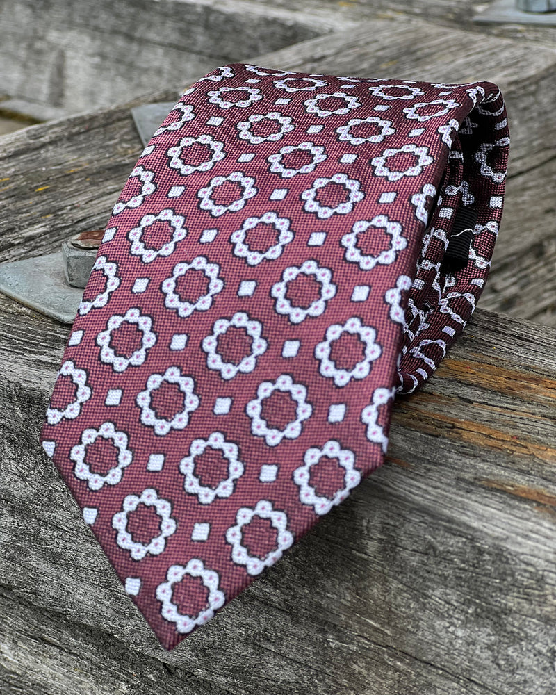 Pure silk tie - muted red background with white circular motif