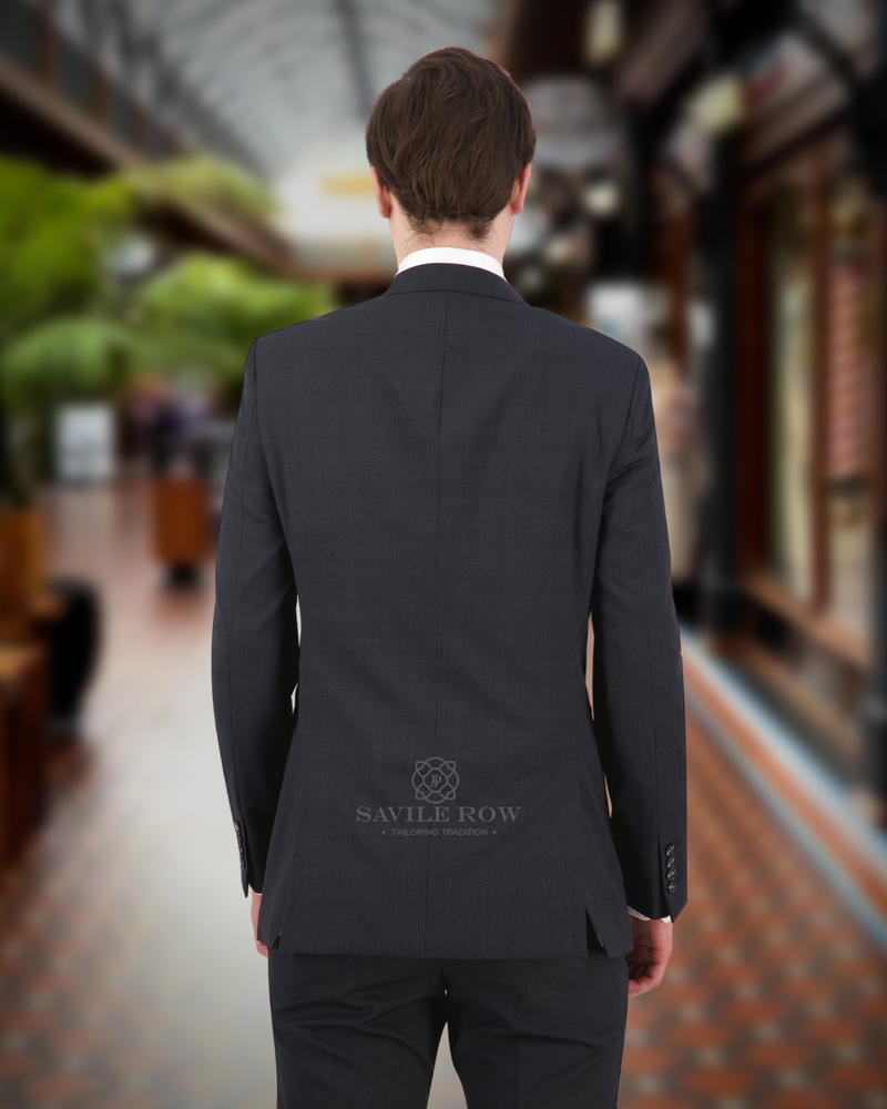 Back view of a young man wearing a charcoal Savile Row wool mix suit