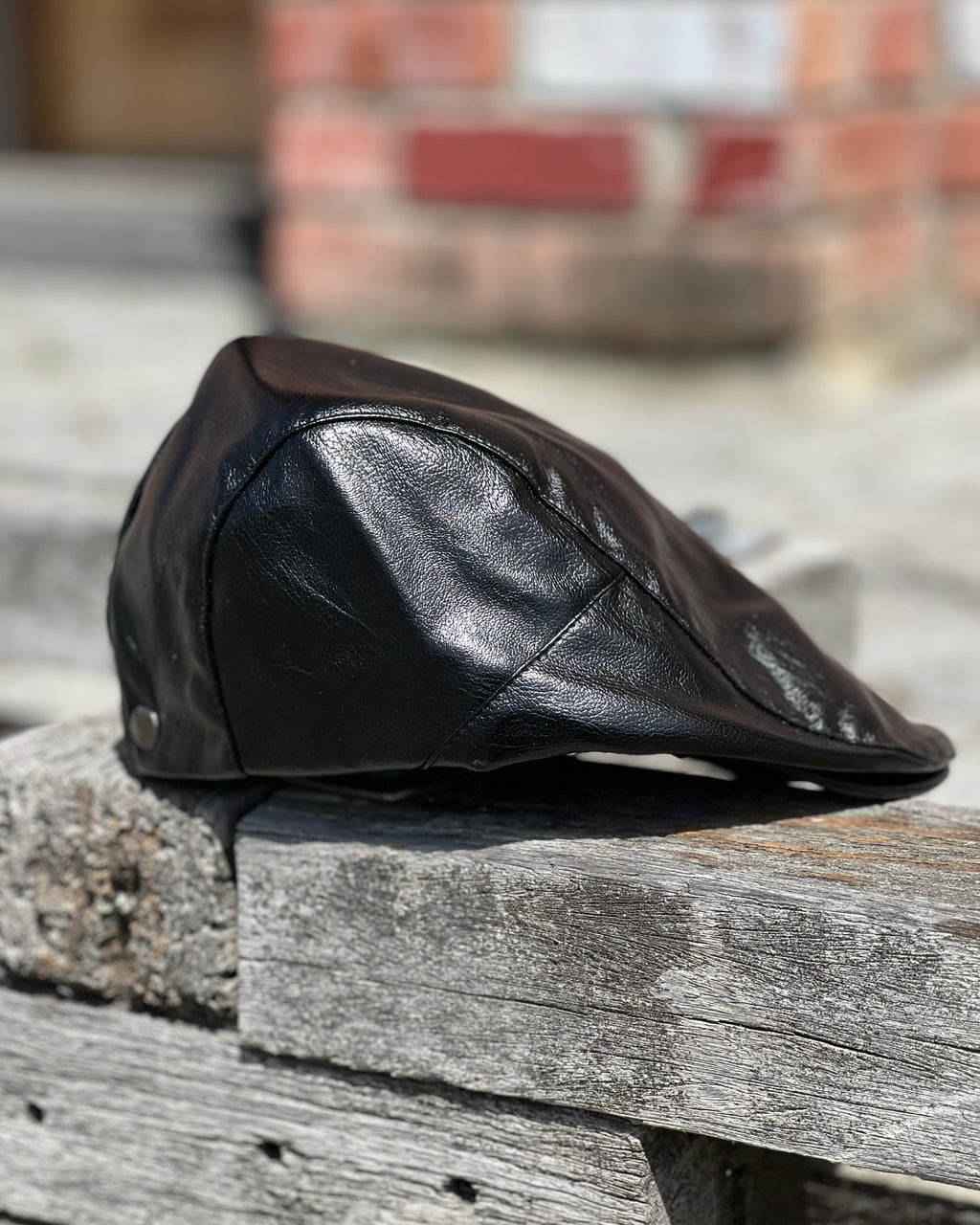 Retro style flat cap in black soft faux leather by Electric Pukeko